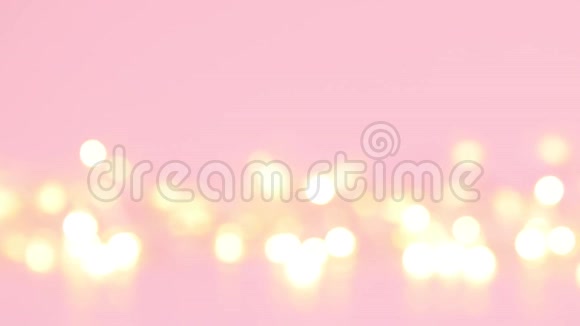 金色的灯光抽象模糊的金色bokeh灯在粉红色的背景上视频的预览图
