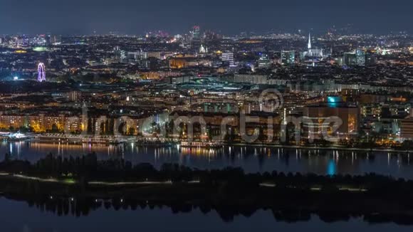 在维也纳城市的空中全景中摩天大楼历史建筑和河边长廊的夜晚时光流逝视频的预览图