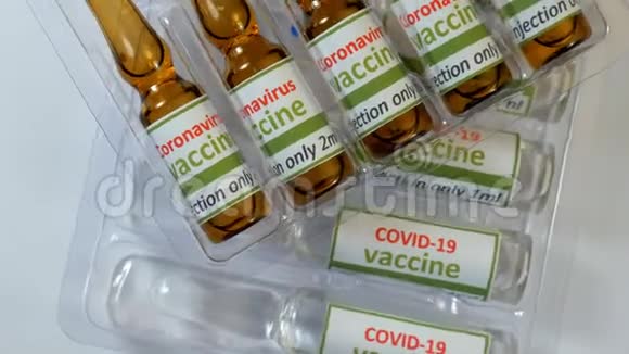 Covid19和ncov冠状病毒疫苗片剂和注射器实验室分析有色液体提取DNA视频的预览图