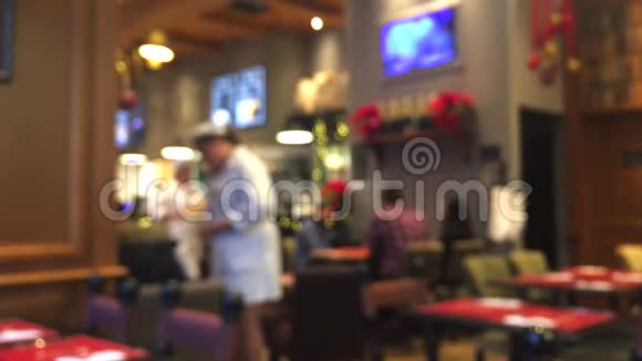模糊的去焦咖啡馆咖啡厅或餐厅内部背景抽象的数字背景模糊的休闲视频的预览图