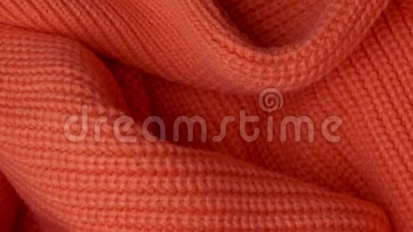 针织橙色羊毛衫的表面视频的预览图