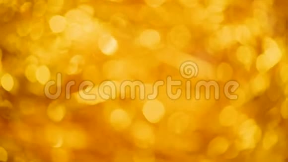 闪亮的抽象纹理背景与金色的灯光博克圣诞节新年概念节日黄金背景视频的预览图
