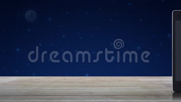 下载现代智能手机屏幕上的平板图标放在木制桌子上放在梦幻夜空和月亮上科技在线视频的预览图