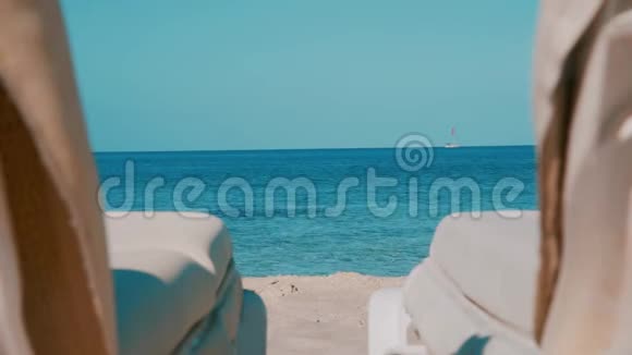海滩上的BalearicIslandFormentera日光浴床视频的预览图