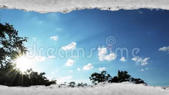 创意时间拍视频快速移动的云在蓝天日落时太阳耀斑是可见的通过纸孔视频的预览图