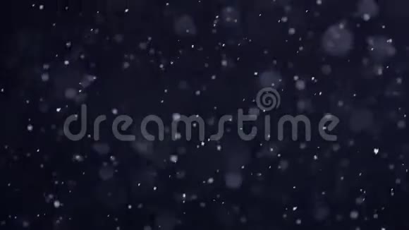 降雪背景夜幕下飘落的雪花视频的预览图