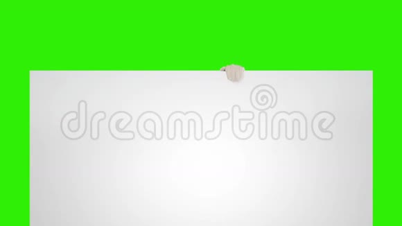 圣诞老人出现在一张白色的床单后面上面有Tex的空间绿色屏幕股票录像视频的预览图
