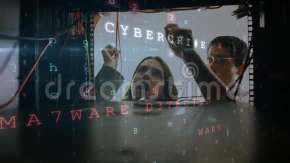一个男人和一个女人在电脑服务器室工作而发光的电路板在前台移动视频的预览图