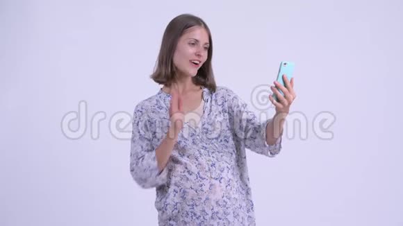 快乐年轻孕妇视频通话显示电话视频的预览图