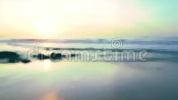 夕阳西下沙滩上波浪起伏海岸的模糊背景视频的预览图