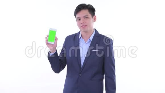快乐的年轻亚洲商人带着电话竖起大拇指视频的预览图