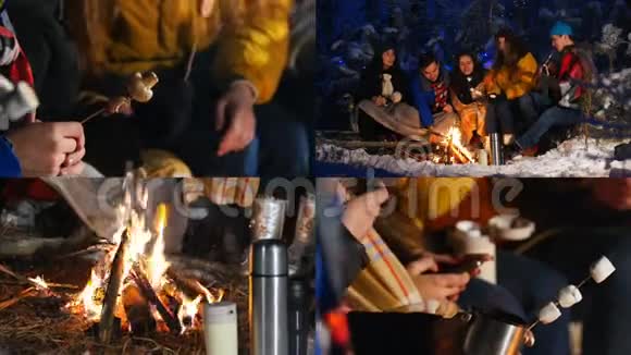 一组朋友在冬天的森林里坐在篝火旁一起吃东西一起玩视频的预览图