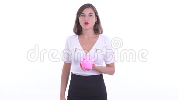 快乐美丽的女商人拿着储蓄罐竖起大拇指视频的预览图