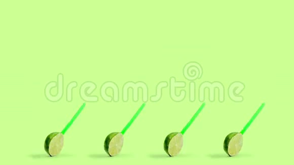 在旋转的绿色背景木棒上切制柠檬水果视频的预览图