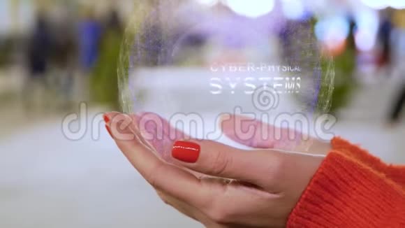 女性手拿着带有文字的全息图网络物理系统视频的预览图