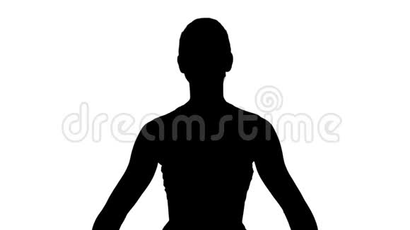 剪影年轻有魅力的女人练习瑜伽坐在gomukasana锻炼身体同时做牛脸姿势视频的预览图