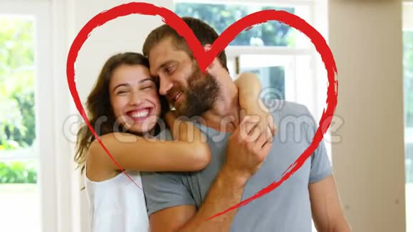 情人节那天一对情侣在家拥抱的肖像视频的预览图