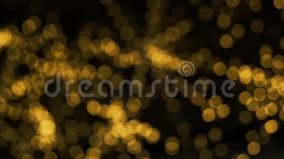 模糊的黄色圣诞照明摘要boke粒子背景视频的预览图