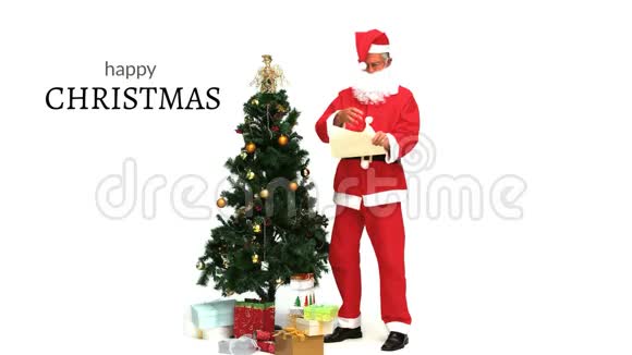 圣诞短信和圣诞树旁边的圣诞老人视频的预览图