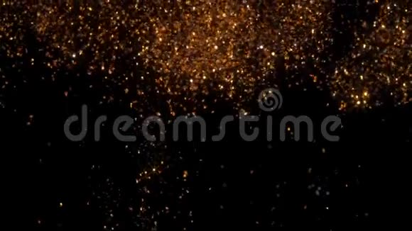 抽象的金色背景与闪亮的波克闪闪发光的粒子圣诞金灯庆典概念宇宙视频的预览图