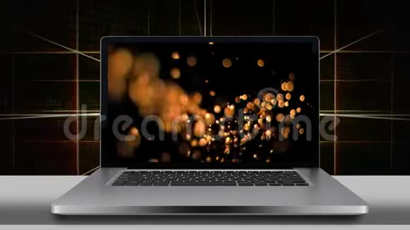 显示金色bokeh灯的笔记本电脑屏幕视频的预览图