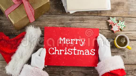 圣诞老人手持红牌带着雪花的视频组合视频的预览图