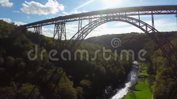 阳光空中拍摄的高大桥梁轮廓铁路视频的预览图
