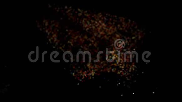 五颜六色的微粒在爆炸后飞舞彩虹撒在黑色的地上飞舞视频的预览图