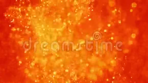水中的金色墨水在红色上闪烁的油漆反应产生抽象的云层形成闪亮的火花可用作视频的预览图