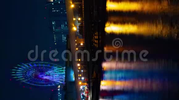 夜游游乐园附近的摩天轮东京时间间隔垂直射击视频的预览图