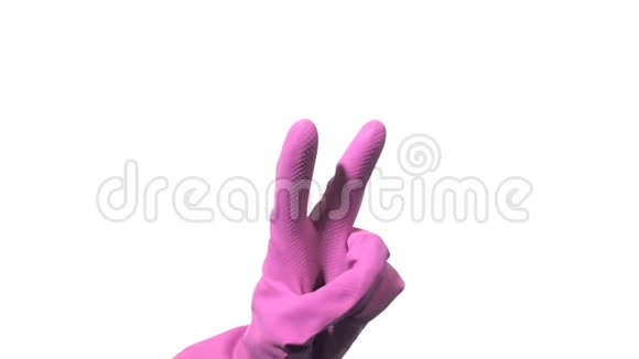 戴紫色橡胶手套的清洁手代表白色背景的胜利视频的预览图