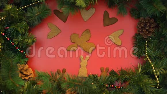天使兔子和心形饼干在节日背景上移动圣诞节视频的预览图