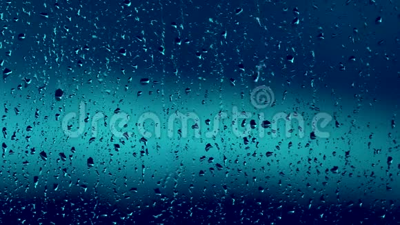蓝色的雨滴在窗户上视频的预览图