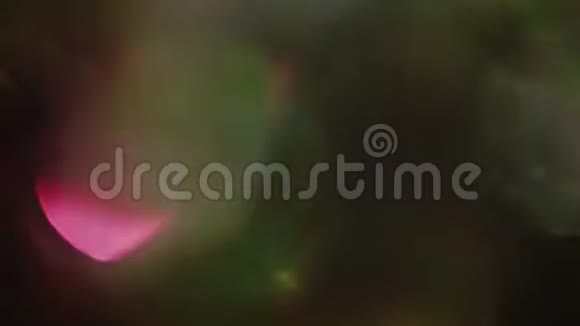 喜庆的颜色爆发全息箔的反射模糊的圣诞灯视频的预览图