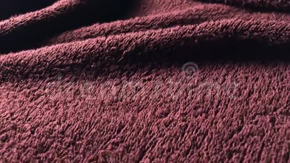 棕色毛巾的质地可以作为背景在4k视频的预览图