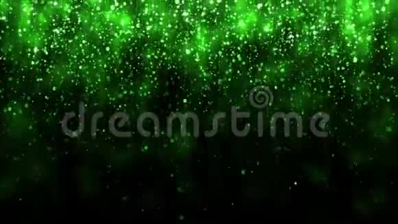 美丽的闪光背景背景带绿色落粒假日设计坠落粒子和魔法光视频的预览图