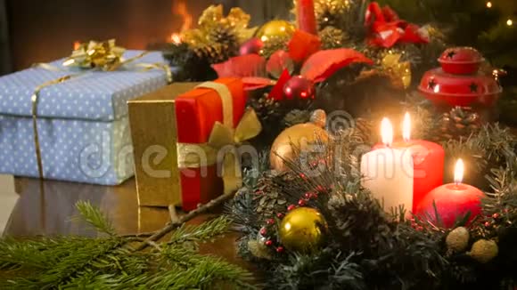 在灯笼蜡烛和圣诞礼物上拍摄4k镜头视频的预览图