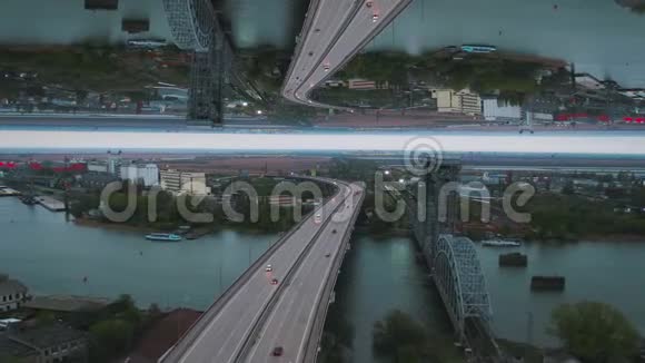 清晨观城带河桥未完工建筑及多棵绿树镜面视界效果媒体视频的预览图