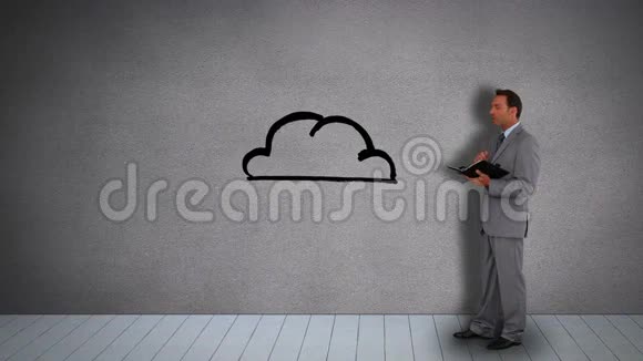 一个看日记的商人看着环绕着云的动画电子设备视频的预览图