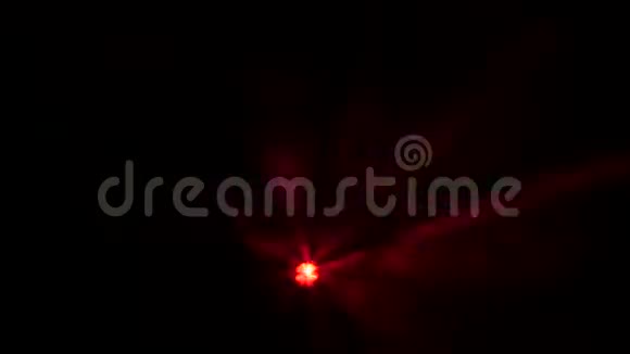 黑色背景烟雾中多色光的探照灯视频的预览图