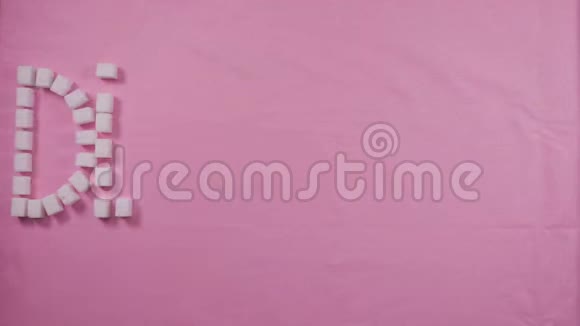 单词diabete在粉红色的背景上内衬精制的糖块龋齿的概念视频的预览图