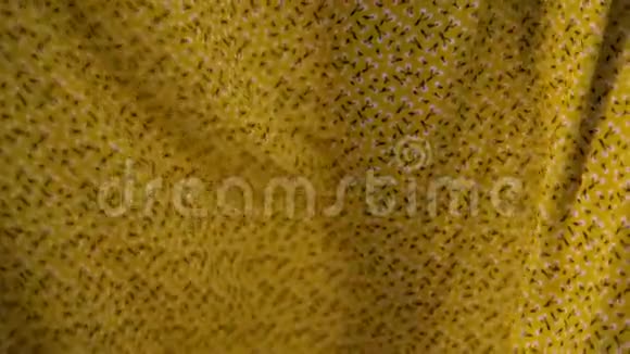 背景的黄色织物纺织纹理特写视频的预览图
