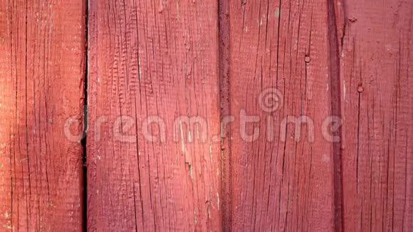 红色旧漆的木制表面背景纹理视频的预览图