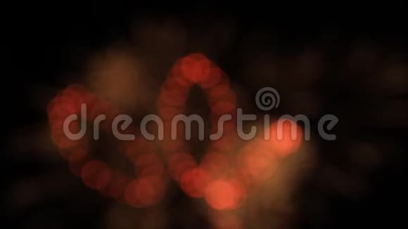 夜空假日背景下红色烟花的图形圆圈形状视频的预览图