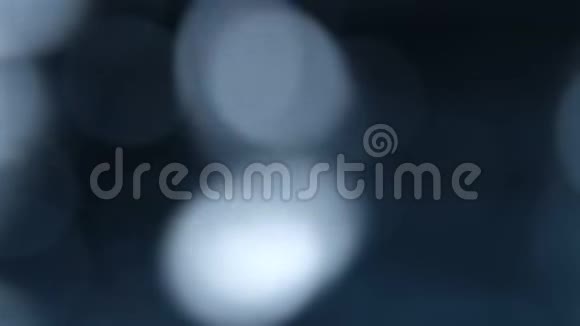 蓝色模糊bokeh灯背景抽象的火花视频的预览图