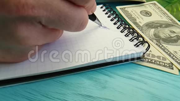 笔记本美元手写慢动作签名处视频的预览图