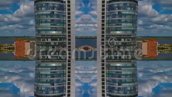 蒙太奇拍摄云下河流背景下的摩天大楼视频的预览图