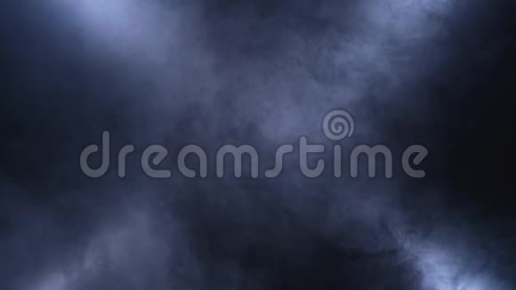 黑色背景下灯光下的烟雾面纱旋转视频的预览图