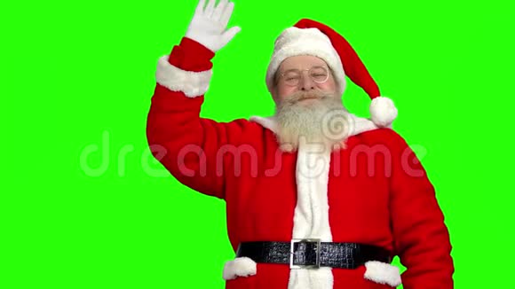 圣诞老人挥舞着手色彩斑斓的背景视频的预览图