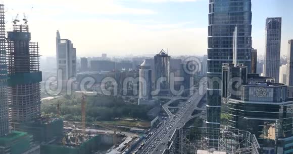 交通繁忙途经北京中央商务区城市大厦视频的预览图